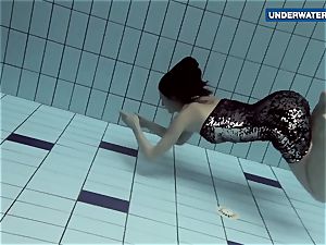 demonstrating bright milk cans underwater makes everyone ultra-kinky